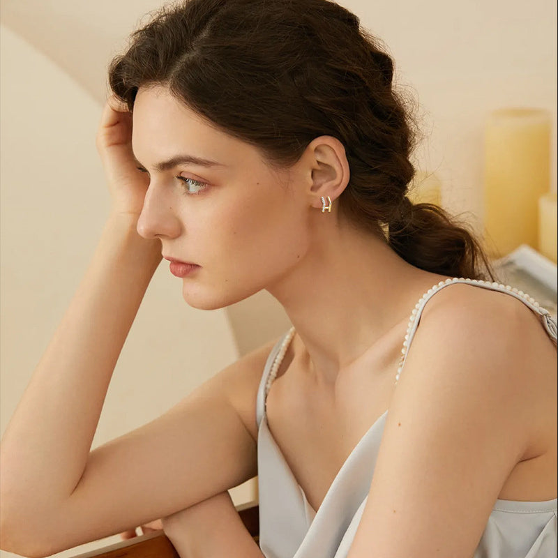 Versatile gold hoops suitable for office and casual styling